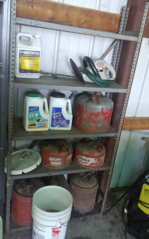 lot 36 image: Shelf & Contents, Metal Gas Cans, Ice Melt, Craftsman Electric Hedger & Extension Cord