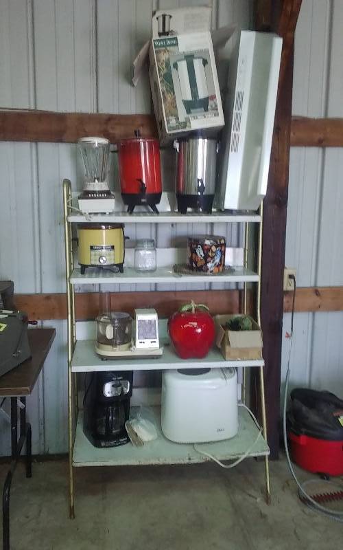 lot 102 image: Shelf & Contents-Kitchen Appliances, Coffee Pots, Oster Bread Maker, Cuisinart Coffee Maker, Blender, Crock Pot, Cookie Jar, Glass Fruits & Vegs
