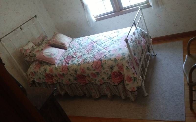 lot 210 image: Iron Bed With Brass Accent-Includes All Bedding, Rug & 2 Empty Tote Bins