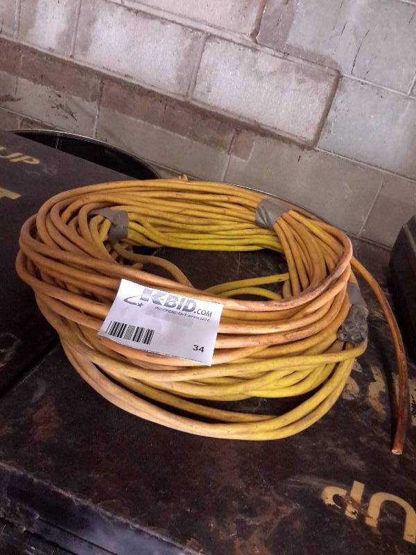 lot 34 image: Long heavy duty cord..Needs male end