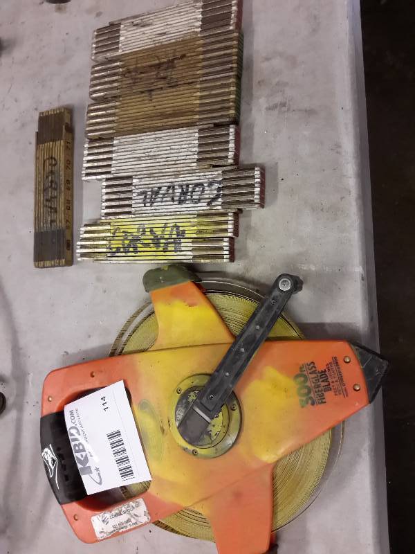 lot 114 image: Lot of folding rulers and Fiberglass 300 ft tape