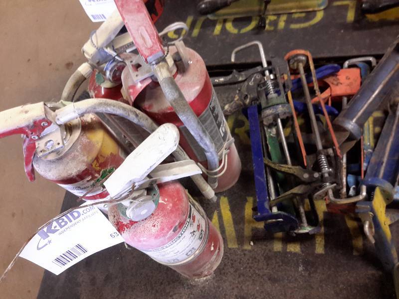 lot 63 image: Lot of fire extinguishers and caulk guns