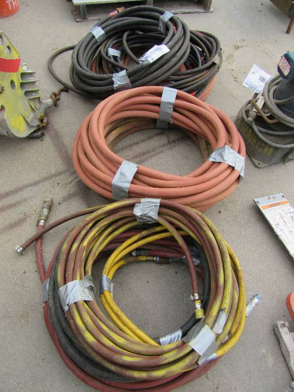 lot 295 image: lot of various types of hoses.. Air, water etc.