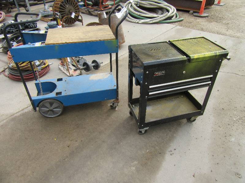 lot 264 image: 2 nice rolling service carts.. One has openclose top for storage.. Lock is stuck. .Just need to get key, or remove lock.