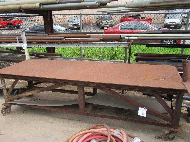 lot 299 image: Heavy Duty Rolling Cart.. 106 in x36in x 31in h.. Has Shelf with sheet metal (out of place).