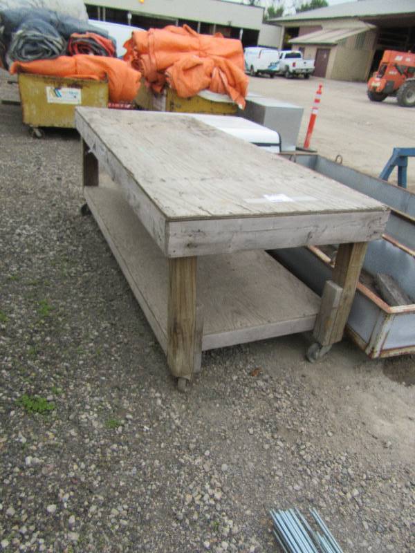 lot 316 image: Large woodplywood work table.  40in x 8 ft x 36in h.. On wheels