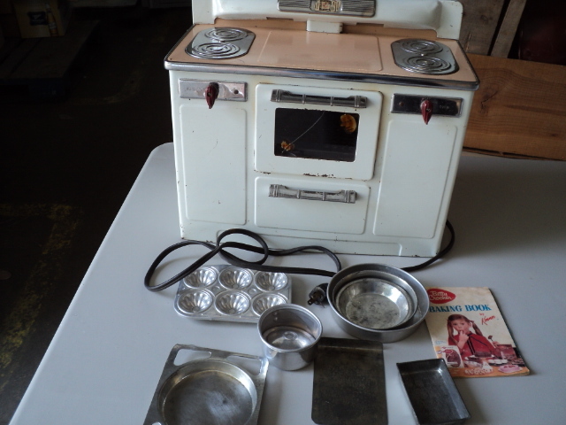 toy Betty Crocker stove and pans...