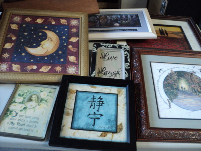 8 pictures and a wood shelf...