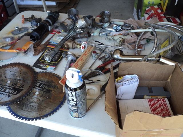 tote of miscellaneous tools and plu...