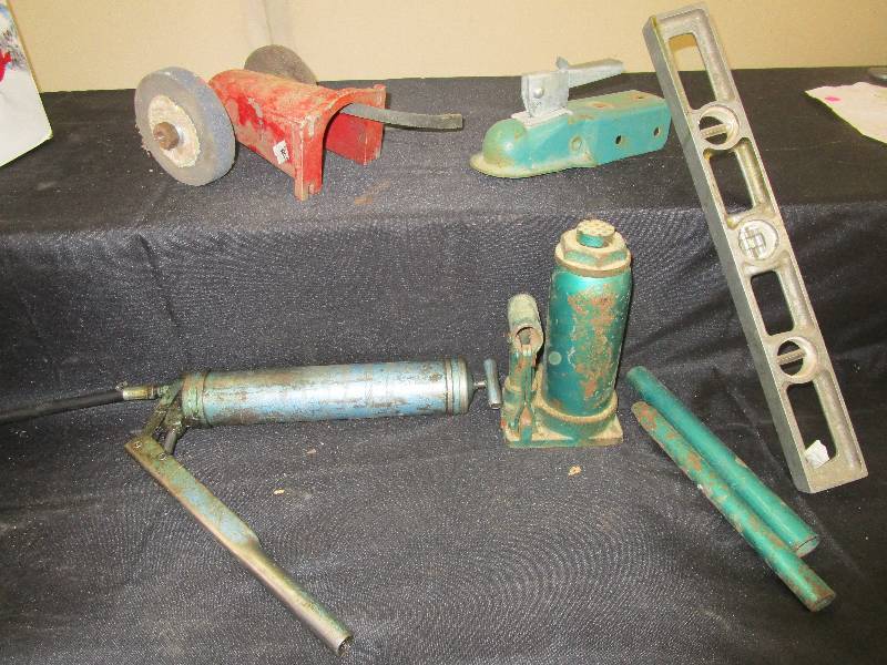 Old level, a jack, greese gun, hitch and more