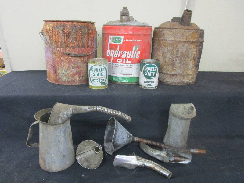 Old oil cans and funnels