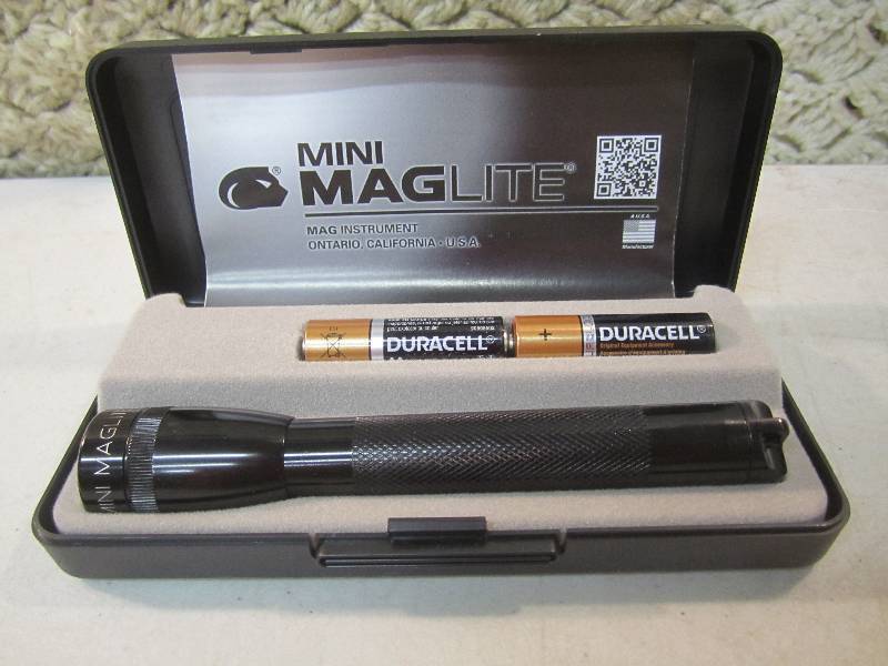 lot 60 image: Mini MagLite in Case Tested and wor...