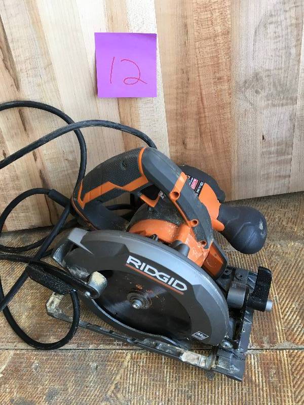 lot 12 image: RIDGID Fuego 12 Amp 6-12 in. Magnesium Compact Framing Circular Saw IN GOOD WORKING CONDITION