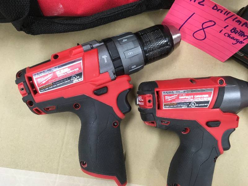 Milwaukee M18 18-Volt Lithium-Ion Brushless Cordless Hammer DrillImpact Combo one battery and charger  in working condition