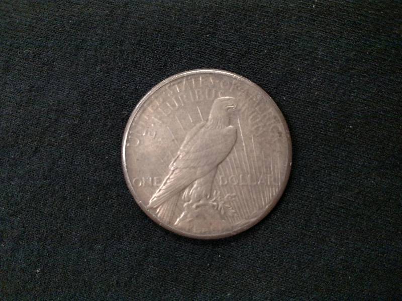 1928 AU Peace Silver Dollar...