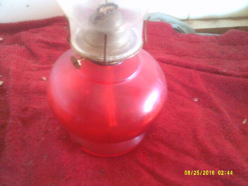 lot 20 image: RED GLASS OIL LAMP