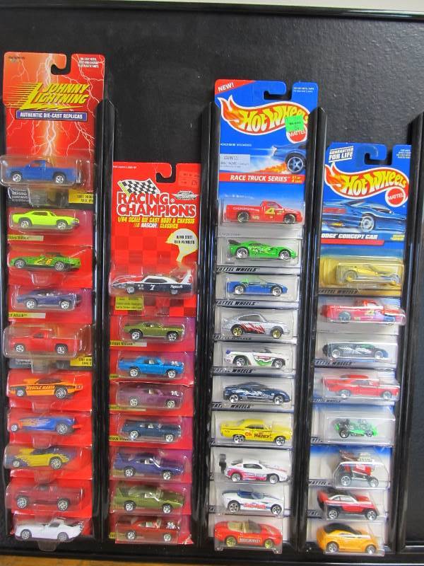 lot 159 image: Large Lot of MIB Hot Wheels Johnny Lightning etc on Wall Display