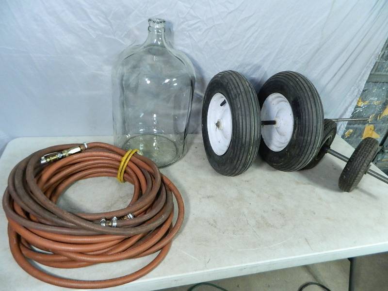 lot 111 image: Glass Jug, Wheels, Tires, Air Hose