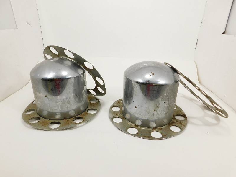 lot 45 image: Two Semi Truck Hub & Nut Log Covers