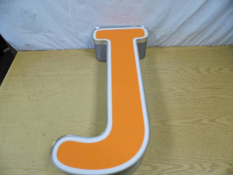 lot 15 image: Metal Letter J - Neon