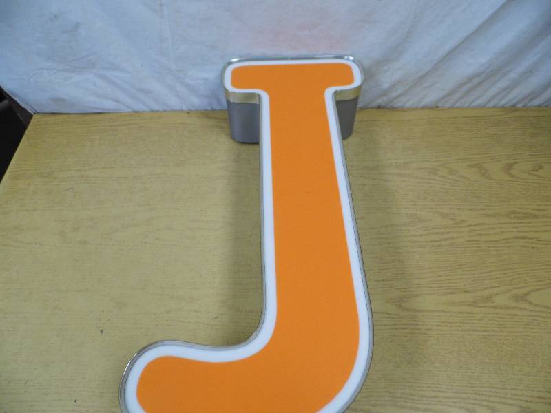 lot 16 image: Metal Letter J - Neon