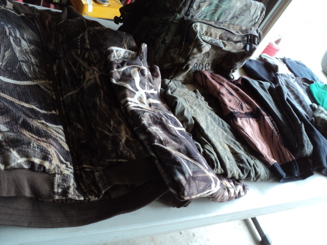 lot 23 image: camouflage clothing, bag, and t-shi...