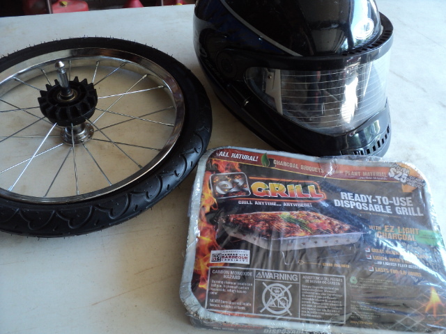 lot 30 image: bike wheel and helmet and disposabl...