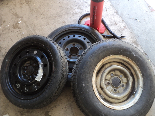 lot 133 image: 3 tires and an air pump...