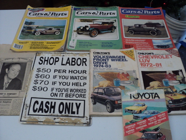 lot 165 image: car books, sign, and paper...