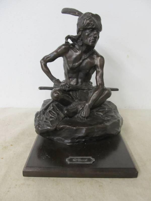 lot 25 image: Charles F Russell Seated Indian wGun Statue