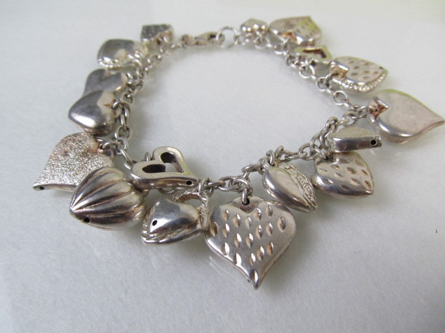 lot 74 image: Signed Sterling Silver Mauritius JCM Jacmel Puffy Heart Charm Bracelet
