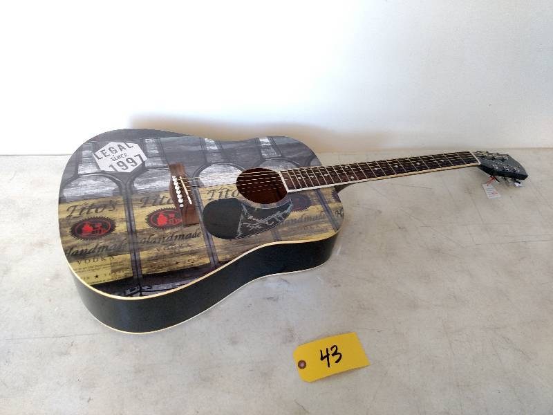 lot 43 image: Titos Vodka Acoustic Guitar...