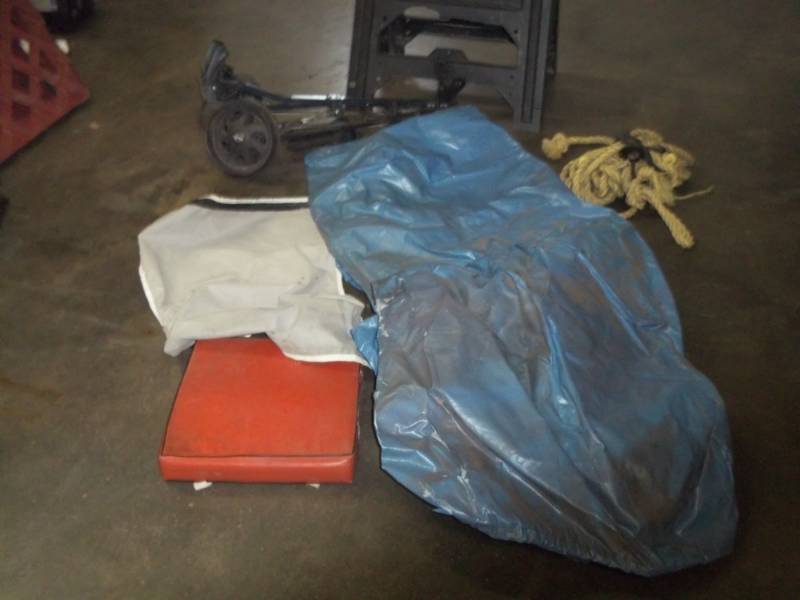 lot 104 image: Tarp, Golf Caddy,  Saw Horse and boat cushion