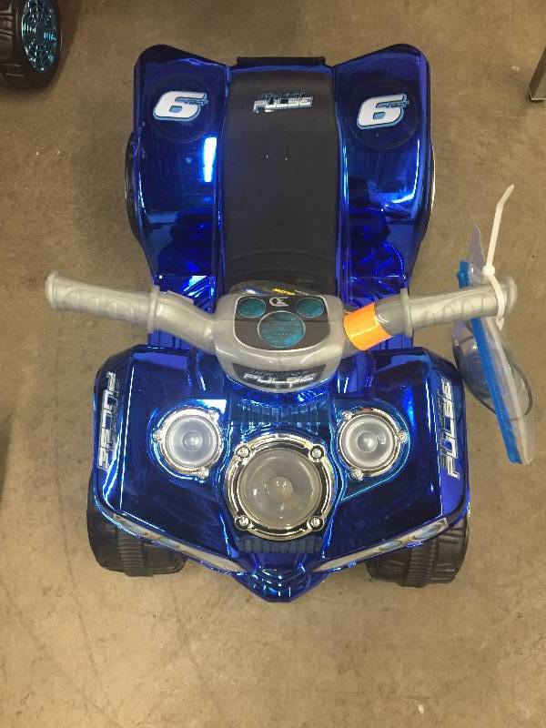 lot 17 image: NEW 6 Volt Blue Pulse Quad Power Wheel