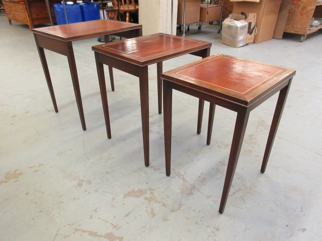 lot 734 image: STACKING TABLES