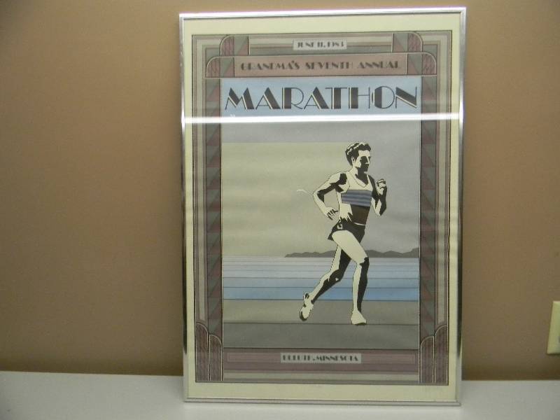 lot 44 image: VINTAGE JUNE 11TH 1983 GRANDMAS SEVENTH ANNUAL MARATHON DULUTH MN - PROFESSIONALLY ALUMINUM FRAMED SIGN - APPROX 21 BY 29 - SEE PICTURES