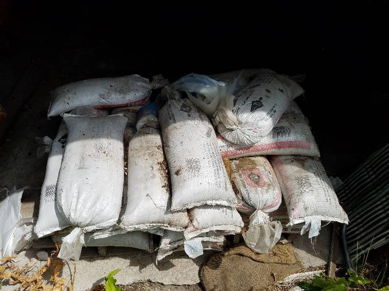 lot 10 image: Pallet of 40 pound Tube Sand Weights with two bags of Poly Plastic Rolls