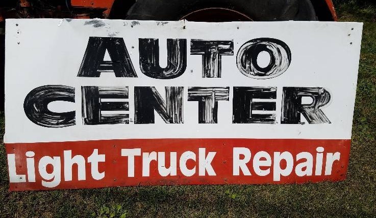lot 99 image: Light Truck Repair Tin Sign