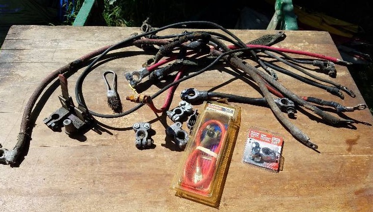 lot 101 image: Several New & Used Battery Cables & Terminals