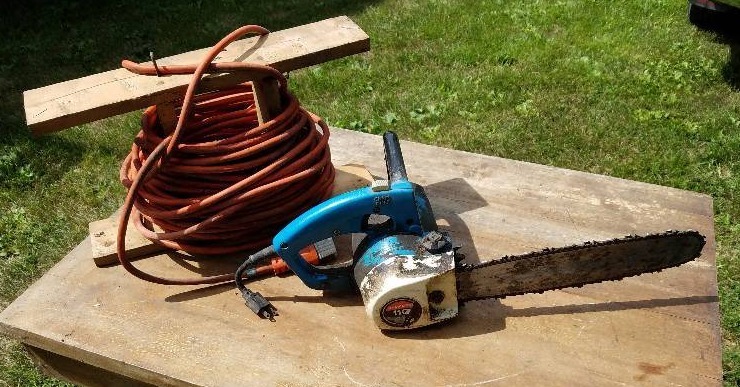 lot 125 image: Extension Cord & Homlite Electric Chain Saw
