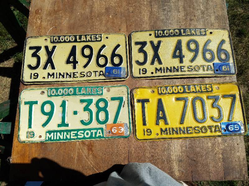 lot 148 image: Licences Plates with metal tags on them from Minnesota