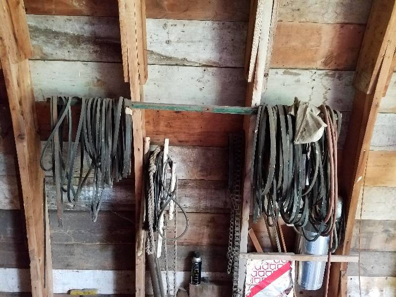 lot 186 image: Large lot of implement belts