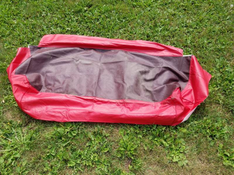 lot 245 image: Red front seat cover for a older vehicle