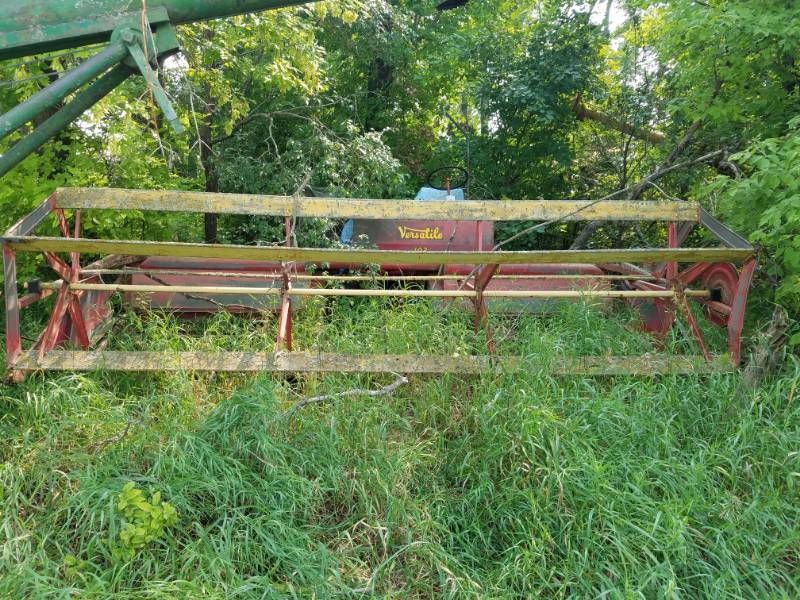 lot 253 image: 103 Versatile Self Propelled Swather with a Wisconsin Motor