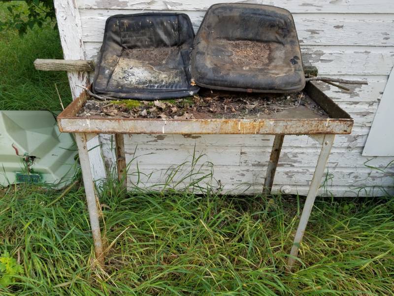 lot 275 image: Metal table and two lawn mower seats