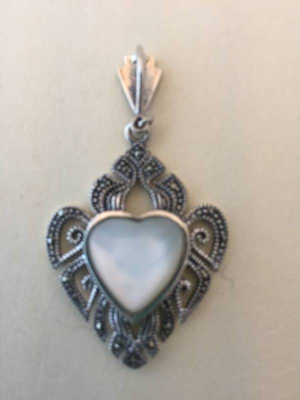 lot 69 image: Sterling Silver Maracasite Mother of Pearl Pendant
