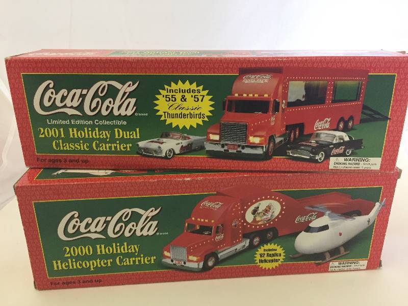 lot 54 image: Coca Cola Semis Cars Helicopters in Boxes