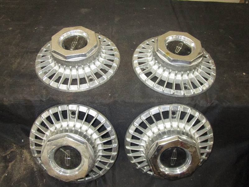 lot 15 image: 4 Metal Hub Caps 9 12in