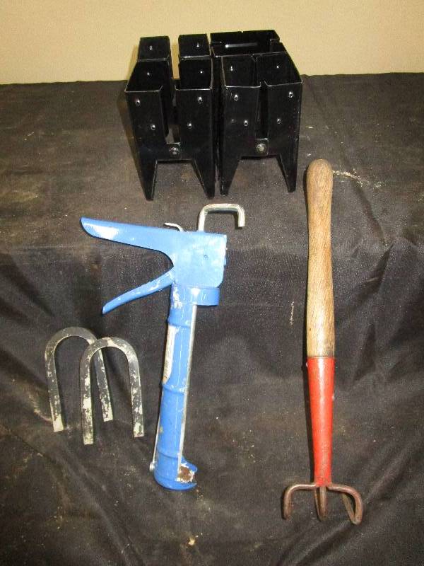 lot 16 image: Short Weeding Rake, 2 Magnets, Caulking Gun, Sawhorse Brackets