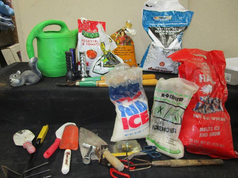 lot 33 image: Garden Tools, Salt, Fertilizer, Watering Can, Pruner, Flashlights, Squirrell and more
